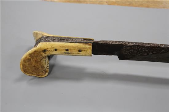A Turkish sword Yataghan, with silver inlaid decoration and inscription, ivory grips, overall length 72cm